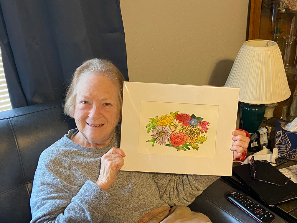 happy client with birth flower painting